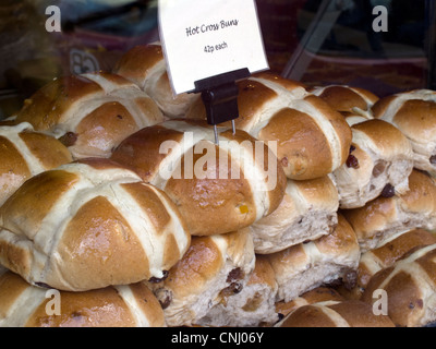Hot cross buns for sale traditionally eaten on Good Friday in many Christian countries . Stock Photo