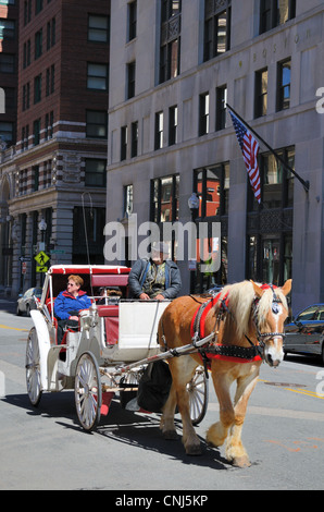 Horse-drawn carriage in the financial district of Boston, Massachusetts. Stock Photo