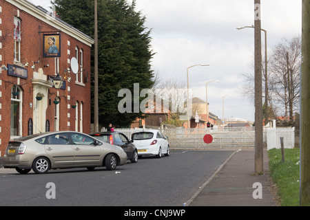 Traffic waiting at the manually operated  level crossing at Daisyfield, Blackburn on the Blackburn to Clitheroe railway line. Stock Photo