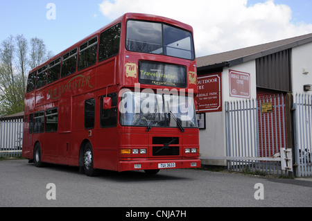 Red double decker Travelmaster bus parked outside Debdale Outdoor Centre in Gorton. Stock Photo