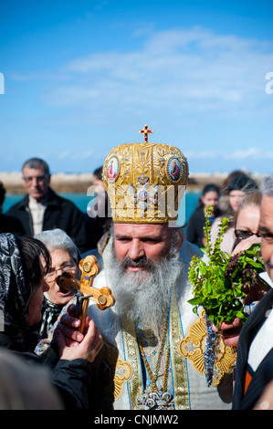 Middle East Israel Jaffa (yaffo) near Tel Aviv -  An Armenian Orthodox priest blesses a cross at the harbor harbour Stock Photo