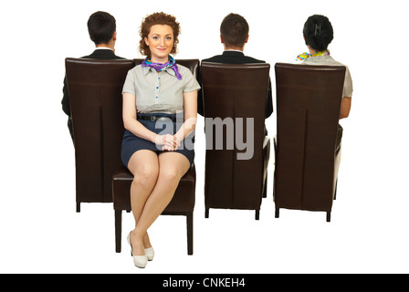Business woman sitting on chair opposed of her colleagues isolated on white background Stock Photo