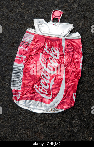 squashed red coca cola can flattened on tarmac road, norfolk, england ...