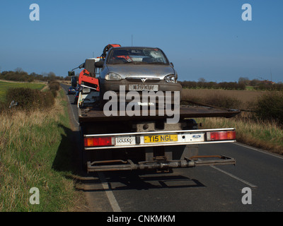 Recovery of a vehicle after an accident upon a sharp bend on a country road (B1325) where the driver lost control of the car. Stock Photo