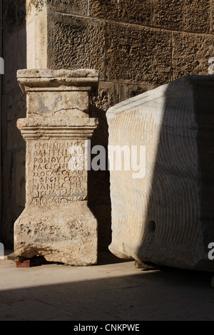 Ancient inscriptions on a pilaster seen at the Roman theater in Amman, Jordan. Stock Photo