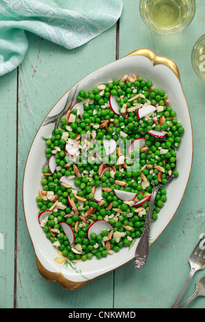 A salad containing English Peas, radish and cheese. Stock Photo