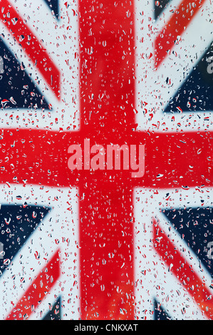 Raindrops on glass in front of a Union jack flag Stock Photo