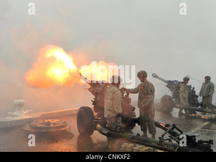 Artillerymen with the Louisiana Army National Guard's 141 Alpha Battalion based in New Orleans fires a 21-gun salute as ships arrive in New Orleans in conjunction with The War of 1812 Bicentennial Commemoration. The events are part of a series of city visits by the Navy, Coast Guard, Marine Corps and Operation Sail beginning in April 2012 and concluding in 2015. New Orleans is the first and the last city visit in the series. Stock Photo