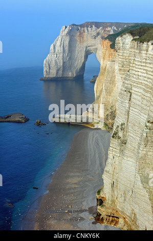La Manneporte at sunset, a natural arch in the chalk cliffs at Etretat ...