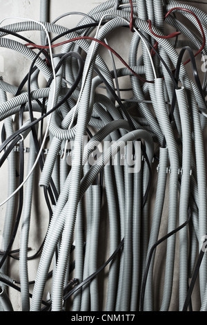 Electric wires on wall in renovation room. Stock Photo