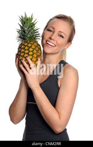Portrait of beautiful young woman holding pineapple isolated over white background Stock Photo