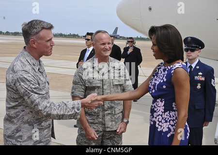 US Air Force Col. Robert Gass, welcomes first lady Michelle Obama upon her arrival April 12, 2012 at Barksdale Air Force Base, LA. Stock Photo
