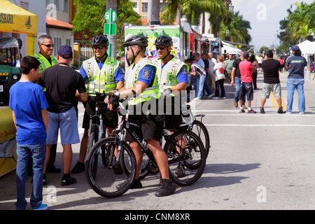 Miami Florida,Hialeah,Palm Avenue,Art on Palm,fair,festival,bicycle patrol,police,policemen,FL120311211 Stock Photo