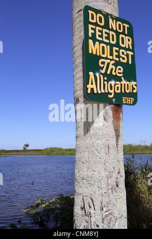 Fort Ft. Lauderdale Florida,Everglades Wildlife Management Area,Everglades Holiday Park,water,sign,do not feed or molest alligators,FL120311218 Stock Photo