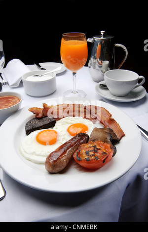 full english breakfast bacon and eggs fry-up in restaurant healthy unhealthy Stock Photo