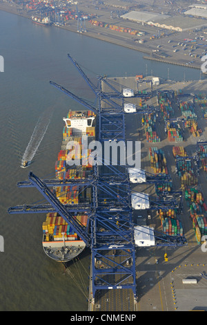 Aerial photograph showing Felixstowe docks with ship in port, cargo containers and cranes. Stock Photo