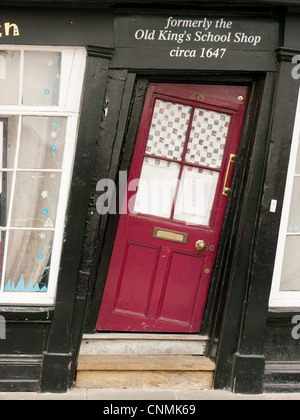 Old King's School shop with crooked red door and windows to let in Canterbury, Kent, UK Stock Photo