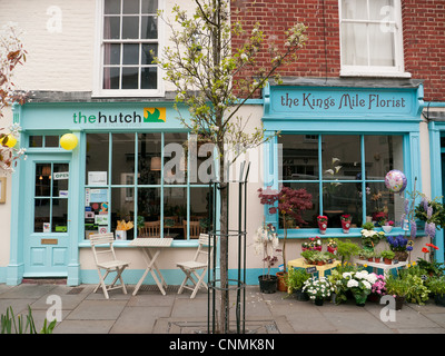 Colourful blue painted cafe and florist in street in Canterbury, Kent, UK Stock Photo
