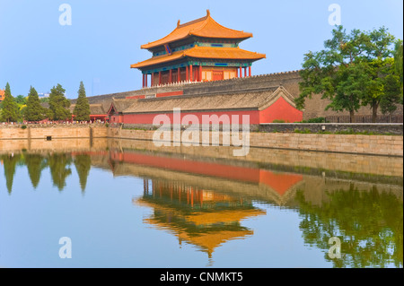 The Gate of Divine Prowess reflected in the Palace Moat (Tongzi He) that surrounds the Forbidden City in Beijing. Stock Photo