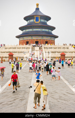 Tourists visiting and taking photographs at the The Hall of Prayer for Good Harvests within the Temple of Heaven complex. Stock Photo