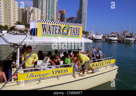 Miami Beach Florida,Biscayne Bay,Miami Beach,Marina,high rise,condominium buildings,city skyline,Biscayne Xpress Water taxi,taxis,passenger passengers Stock Photo