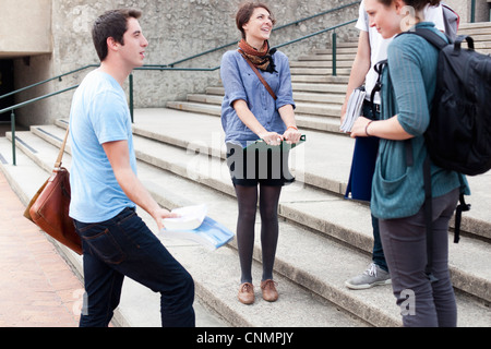 Students talking on campus steps Stock Photo