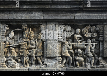 Stone bas relief from the Borobudur Temple in Magelang, Central Java, Indonesia. Stock Photo