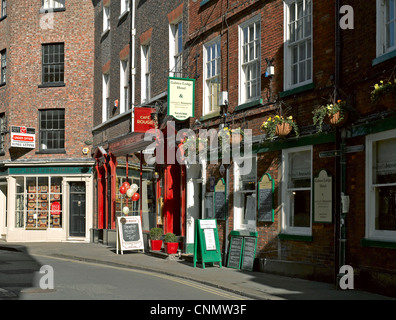 Businesses in Low Petergate York North Yorkshire England UK United Kingdom GB Great Britain Stock Photo