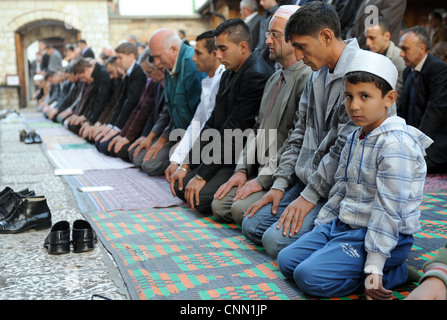 Bosnian Muslims pray in Sarajevo, celebrating the biggest Islamic religious holiday Eid AL -Adha. Stock Photo