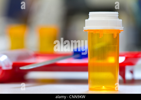 pharmacy bottle with a counting tray in the background, inside a pharmacy Stock Photo