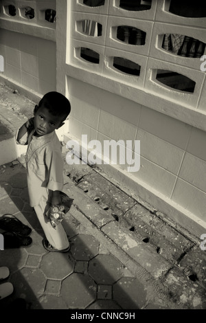 young muslim boy going to prayers , mosque,muslim community ,koh samui,thailand Stock Photo