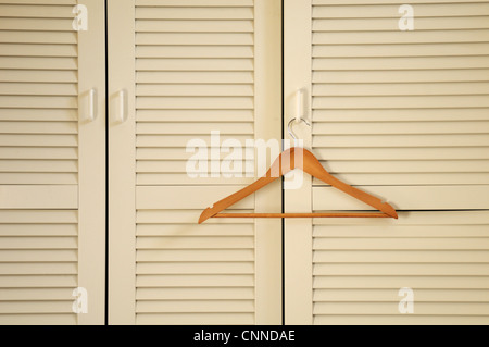 Wooden Hanger on Closet Door, Alpes, France Stock Photo