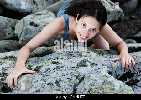 Close up of woman climbing rock Stock Photo