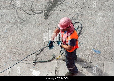 dock worker with safety gear PPE seen from above Stock Photo