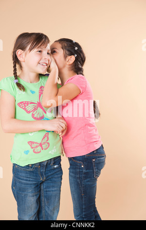 Portrait of Girls Whispering Stock Photo