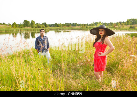 Couple by Pond, Unionville, Ontario, Canada Stock Photo