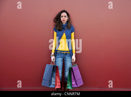 Young woman outdoors with shopping bags Stock Photo