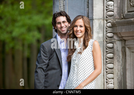 Portrait of Young Couple in Park Stock Photo