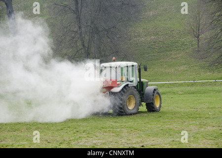 John Deere 6420S tractor spreader spreading Calciprill granular lime on grassland Bolton Abbey North Yorkshire England april Stock Photo