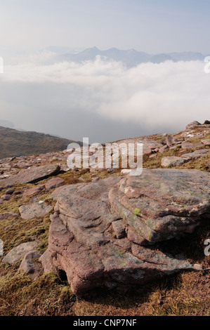 Sandstone rocks on Slioch, mountain in Torridon, Wester Ross, Scottish Highlands, Scotland, Beinn Eighe in the distance Stock Photo