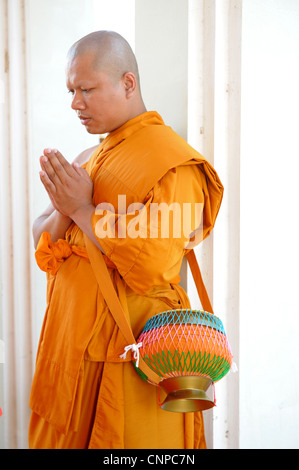 monk praying  , monk ordination ceremony ,wat pong pang ,buddhist religion , samut sakhon , thailand Stock Photo