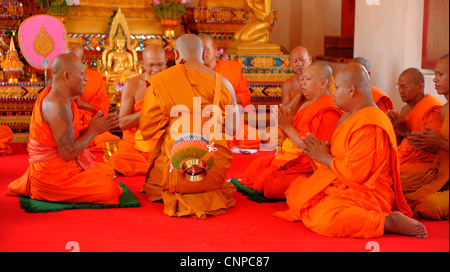 monks praying  , monk ordination ceremony ,wat pong pang ,buddhist religion , samut sakhon , thailand Stock Photo