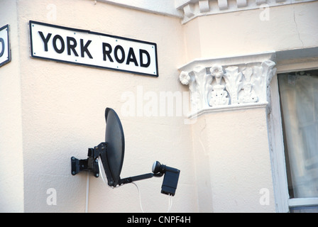 satellite dish in residential area Eastbourne United Kingdom Stock Photo