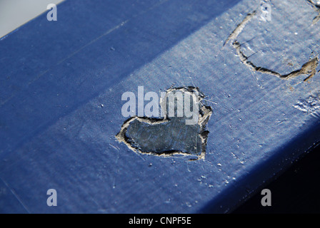 heart shaped carving in park bench Eastbourne United kingdom Stock Photo