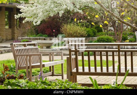 Yellow tennis ball on bench by tennis court Stock Photo