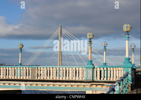 Old Scarisbrick Avenue Bridge over Marine Lake, Southport. Merseyside, with modern Marine Way cable stayed bridge in background Stock Photo