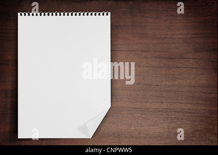 Blank paper on wood wall backgound with a path Stock Photo