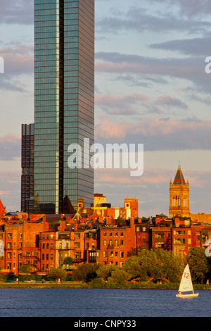 Boston's John Hancock Tower in late summer sunlight with Back Bay neighborhood and Charles River in the foreground Stock Photo