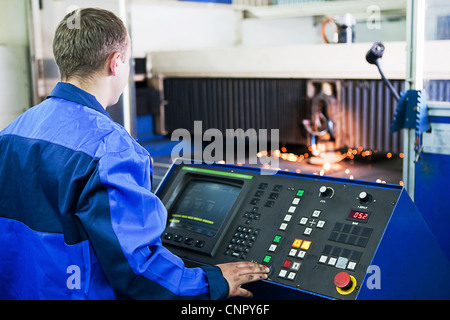 Man stand near buttons and screen Stock Photo