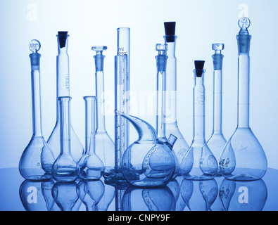 Research Lab assorted Glassware Equipment on blue background Stock Photo